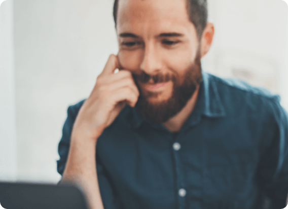 personal-banking-checking-get-in-touch Man seated looking at computer